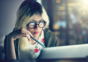 Woman on laptop doing research