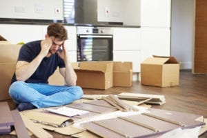 Man putting furniture back together