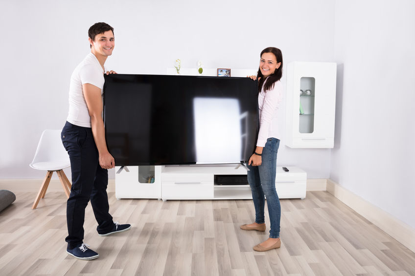 Couple moving their electronics